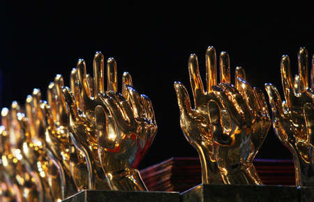 Golden sculpture hands, awards ceremony