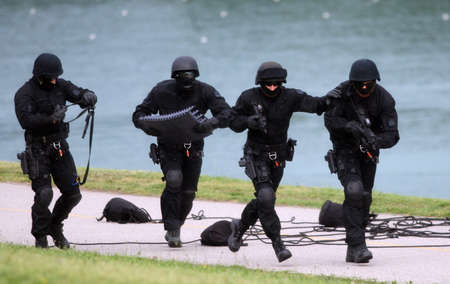 Armed soldiers taking out terrorist