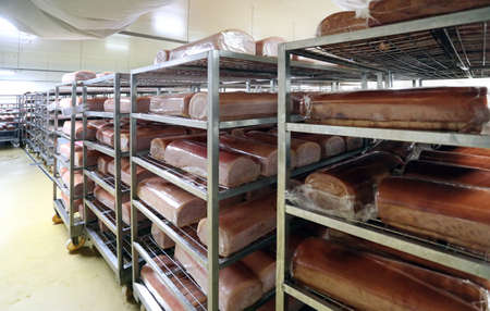 Piaces of meat, pork meat in big fridgeの写真素材