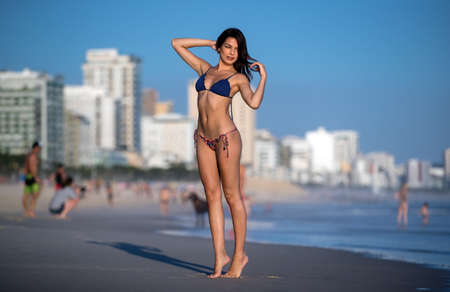 Beautiful girl in bikini on Leblon beach in Rio de Janeiroの写真素材