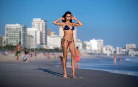 Beautiful girl in bikini on Leblon beach in Rio de Janeiroの写真素材