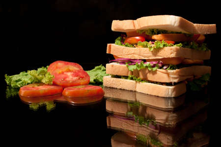 Homemade yummy sandwich on black backgroundの写真素材