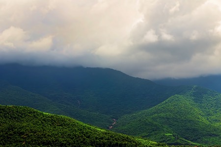 Mountain in the cloudy morning, Asia. Green valleys, peace of nature.