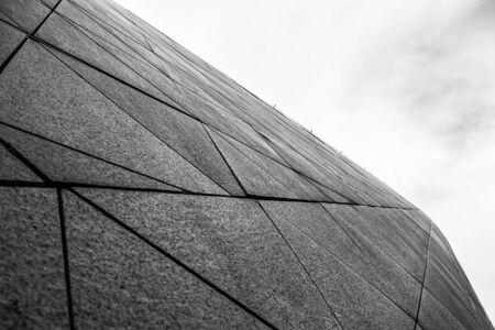 Close up structure of modern building. Grey colored city wall. Grunge backgraund.の写真素材