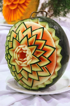 Patterns made in watermelon, decoration of table, flower made of jusy berry. Food photagraphy.の写真素材