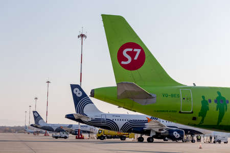 Russia, Vladivostok, 10/13/2017. Passenger jets of S7 Airlines and Aurora Airlines on airfield....