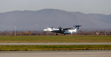 Russia, Vladivostok, 10/13/2017. Passenger plane Bombardier Q400 of Aurora Airlines takes off....