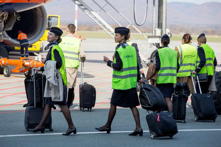 Russia, Vladivostok, 10/13/2017. Beautiful stewardesses dressed in official dark blue uniform of...