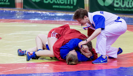Russia, Vladivostok, 06/30/2018. Wrestling competition among girls born in 2003-2004. Teenage tournament of martial arts and fighting sports.のeditorial素材