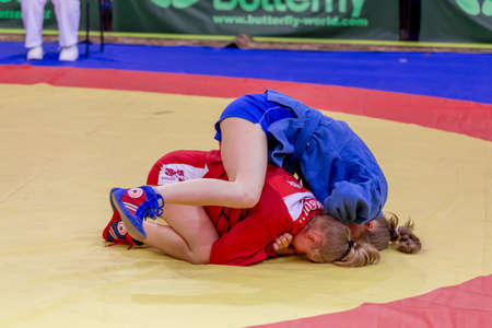 Russia, Vladivostok, 06/30/2018. Wrestling competition among girls born in 2003-2004. Teenage tournament of martial arts and fighting sports.のeditorial素材