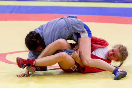 Russia, Vladivostok, 06/30/2018. Wrestling competition among girls born in 2003-2004. Teenage tournament of martial arts and fighting sports.のeditorial素材