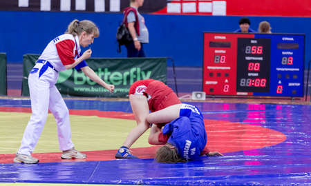 Russia, Vladivostok, 06/30/2018. Wrestling competition among girls born in 2003-2004. Teenage tournament of martial arts and fighting sports.のeditorial素材