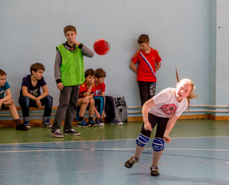 Russia, Vladivostok, 04/28/2018. Kids play handball indoor. Sports and physical activity. Training and sports for children.のeditorial素材