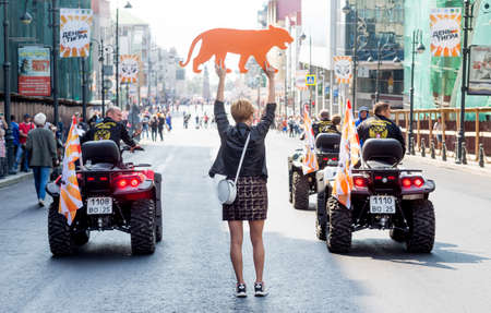 Russia, Vladivostok, 09/29/2019. Participants of annual festive Tiger Day in downtown. Nice woman...