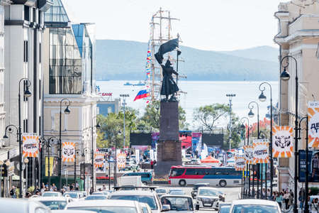 Russia, Vladivostok, 09/21/2019. Downtown of Vladivostok with view on famous Memorial to the Fighters for the Soviet Power. A lot of cars on main street and people walk by central square.のeditorial素材