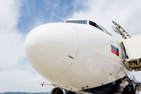 Modern commercial passenger jet with flag of Russia on fuselage on airfield. Russian airlines concept. Welcome to Russia concept. Aviation and transportation.のeditorial素材