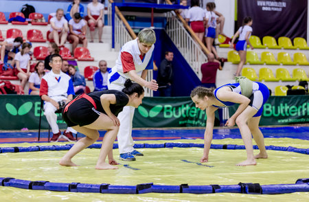 Russia, Vladivostok, 06/30/2018. Sumo wrestling competition among girls born in 2003-2004. Sumo is a traditional Japanese martial art. Teenage tournaments of martial arts and fighting sports.のeditorial素材