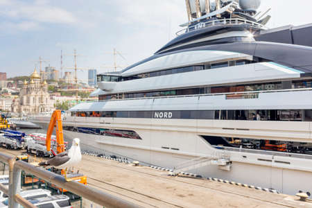 Vladivostok, Russia, May 16, 2022. Seagull at front of luxury yacht NORD at the pier. The yacht is owned by Alexei Mordashov, the Russian billionaire and owner of Severstal. Life of billionaires.のeditorial素材