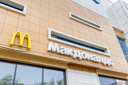 Russia, Vladivostok, May, 25, 2022. Logotype on facade of McDonald's restaurant. fast food restaurant.のeditorial素材