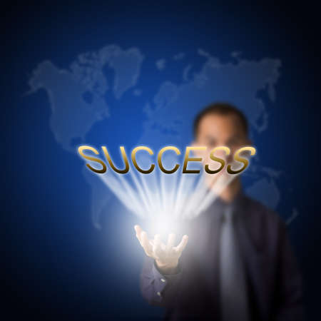 business man holding success in handの写真素材