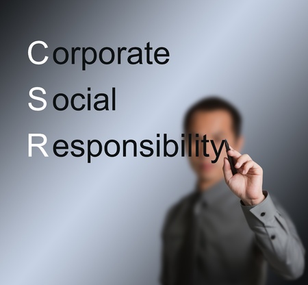 business man writing corporate social responsibility   CSR   conceptの写真素材