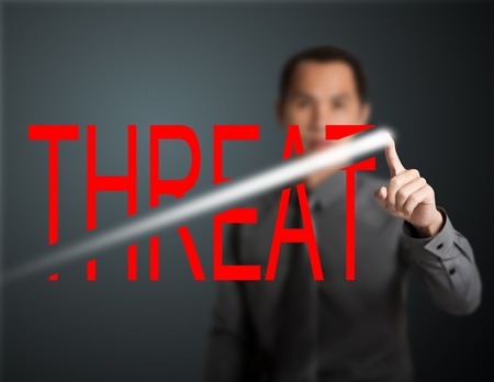 business man breaking through threatの写真素材