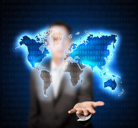 businessman holding blue digital world mapの写真素材