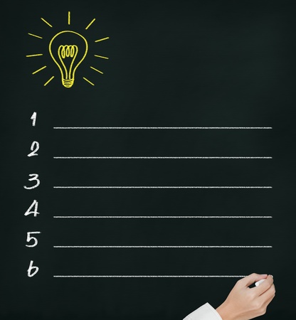business hand writing idea or innovation list on chalkboardの写真素材