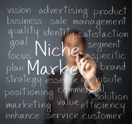 business man writing niche market conceptの写真素材