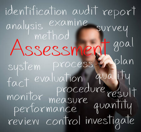 business man writing assessment conceptの写真素材