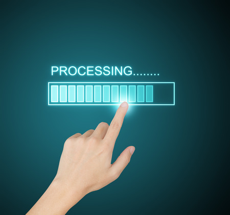hand pressing processing progress on screenの写真素材