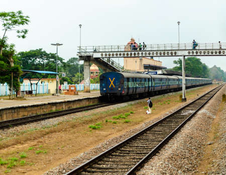 Train at a rural railway stationの写真素材