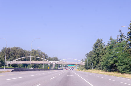 A overpass bridge with two arches across a highwayの写真素材