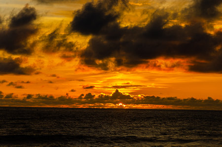 Cloudy sunset on the beach at Tanneeru Bhavi,  Mangalore, Indiaの写真素材
