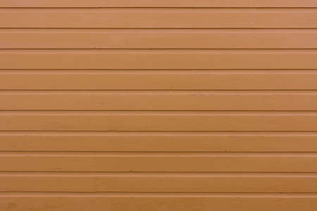 Original Scandinavian wood texture painted in yellow-orange 1. The color is authentic and not modified anyhow. Images are taken from real house fronts in Scandinavia.の写真素材