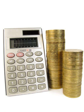 Calculator with coins on a white backgroundの写真素材