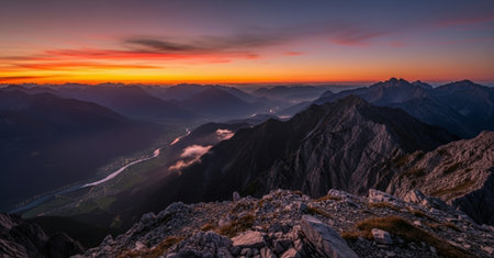 Sunset in the Austrian Alps. Panoramic view of the mountain range.の素材