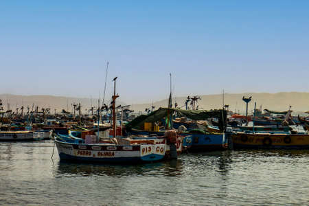 Paracas, Peru, May 2022 - fishing boats by portの写真素材