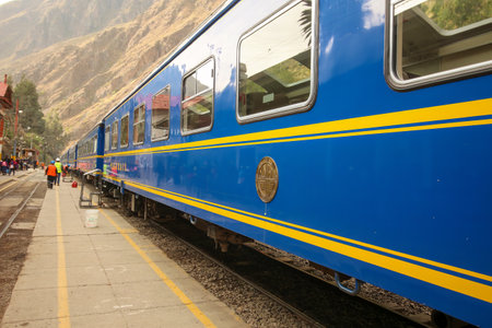 Ollantaytambo, Peru - May 25 2022: Tourist train from Cusco to Machu Picchu standing at Ollantaytambo stationのeditorial素材