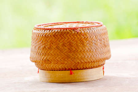 Kratip or sticky rice basket container that is the bamboo container for holding cooked glutinous rice.の写真素材