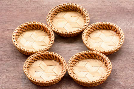Saucer or plate made of bamboo which is the basketwork.の写真素材