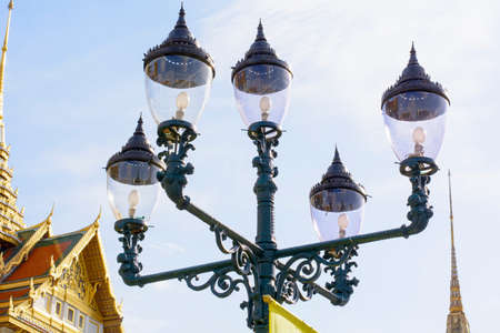 Metal street lamp with blue sky in grand palace, bangkok thailandの写真素材