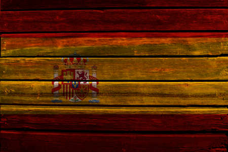 Flag of Spain on a wood wall background.の写真素材