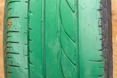 The used car tires, painted green color.の写真素材