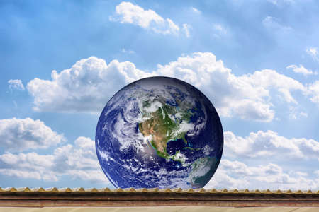Planet World on the roof, on the blue sky.の写真素材