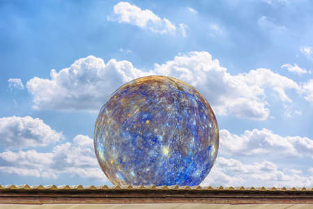 Planet Mercury on the roof, on the blue sky.の写真素材