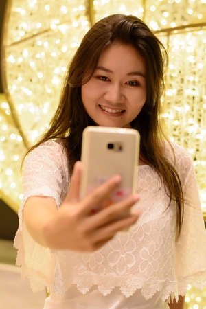 Women selfie in the new year festival.の写真素材