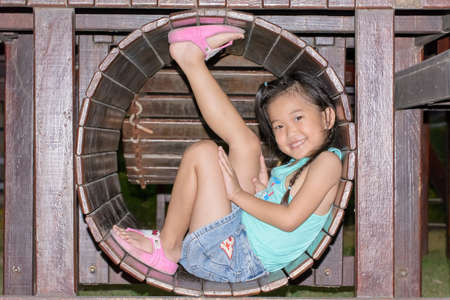 A girl in a children's play park.の写真素材