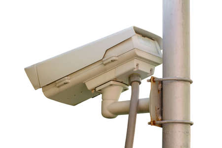 CCTV camera mounted on a steel pole on a white background.