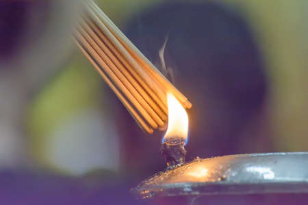 The incense of oil lamps. It's used in Buddhism.の写真素材